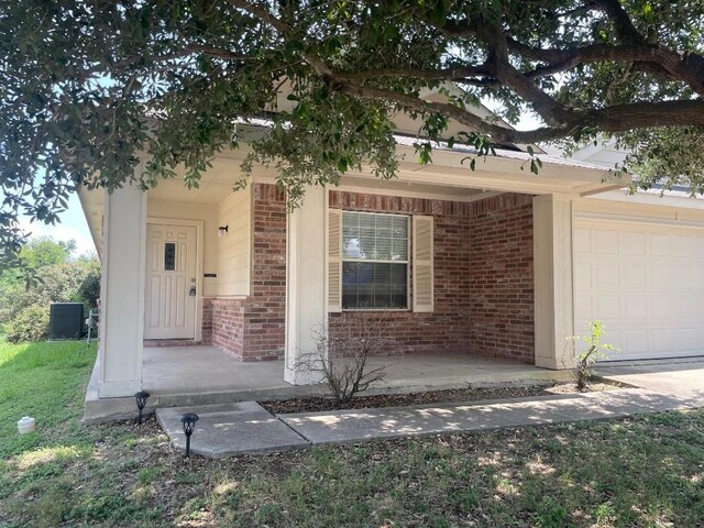 entrance to property featuring a garage