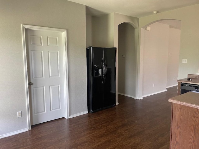 17905 Basketflower Bnd, Elgin, TX 78621 - kitchen featuring dark hardwood / wood-style flooring and black appliances