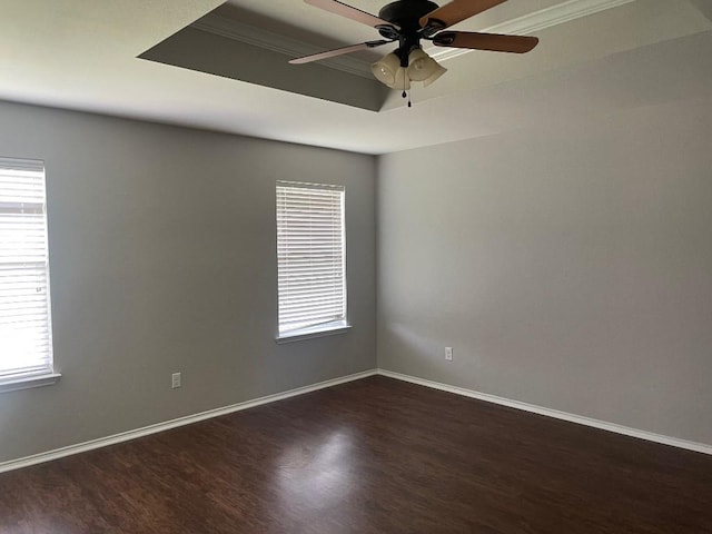 17905 Basketflower Bnd, Elgin, TX 78621 - empty room featuring a raised ceiling, dark hardwood / wood-style floors, and ceiling fan