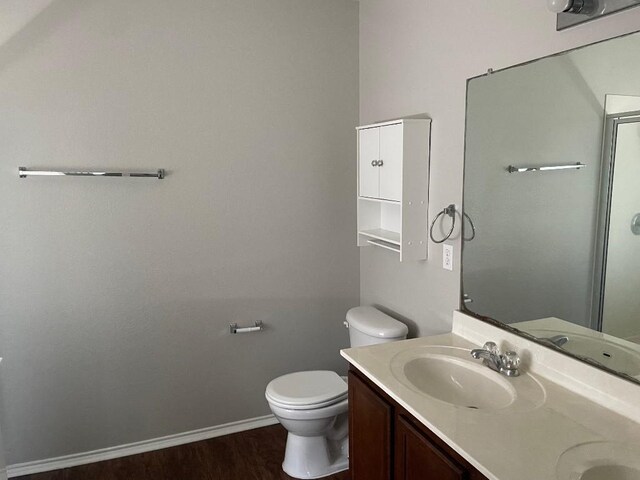 17905 Basketflower Bnd, Elgin, TX 78621 - bathroom featuring hardwood / wood-style flooring, vanity, and toilet