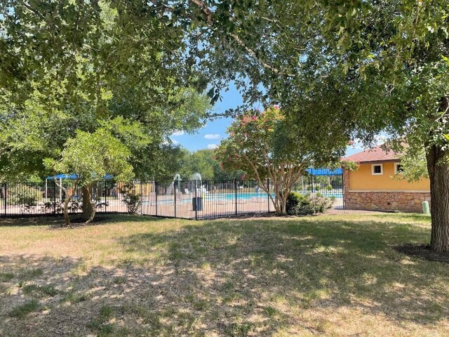 17905 Basketflower Bnd, Elgin, TX 78621 - view of yard with a community pool