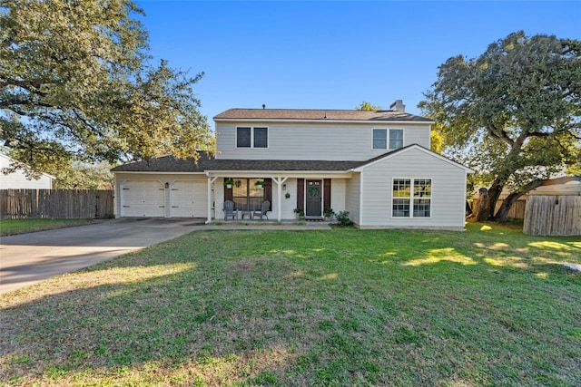 view of front property with a garage and a front yard