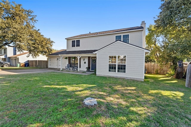 front facade featuring a garage and a front yard