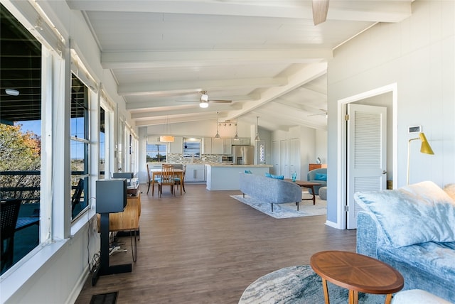 living room with dark wood-type flooring, ceiling fan, and vaulted ceiling with beams