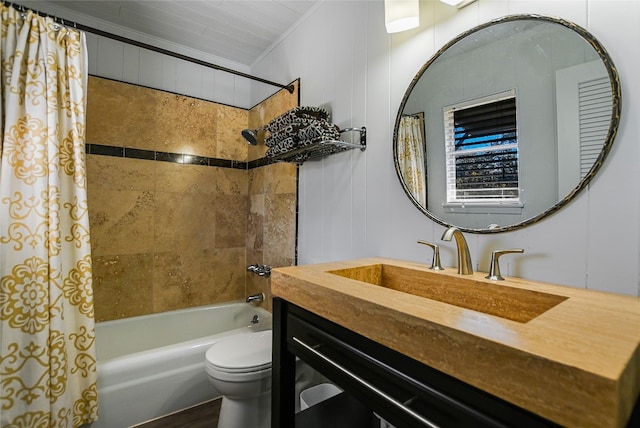 full bathroom with crown molding, vanity, toilet, and shower / bath combo with shower curtain