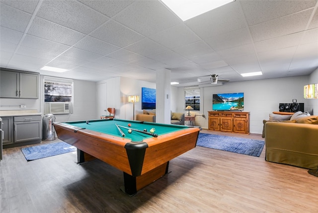 recreation room featuring pool table, a drop ceiling, light hardwood / wood-style floors, and cooling unit