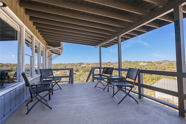 view of patio featuring a balcony