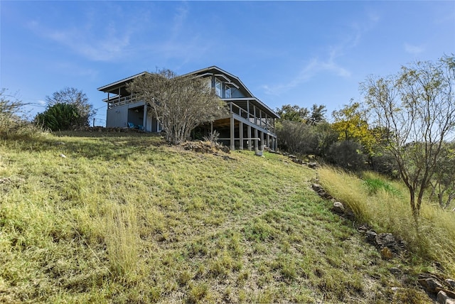 back of property featuring a deck