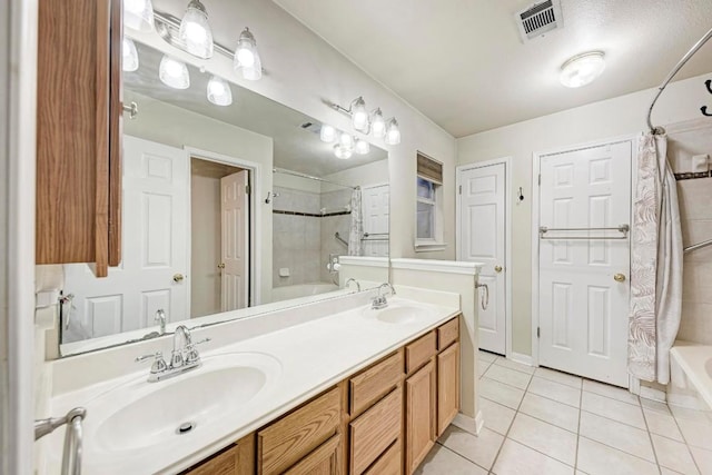 bathroom featuring vanity, shower / bathtub combination with curtain, and tile patterned flooring