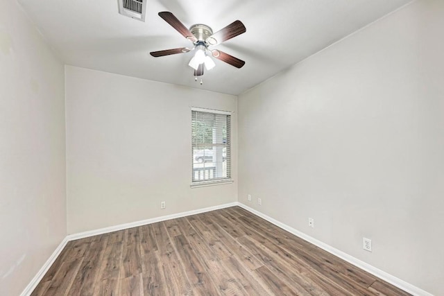 unfurnished room with hardwood / wood-style floors and ceiling fan