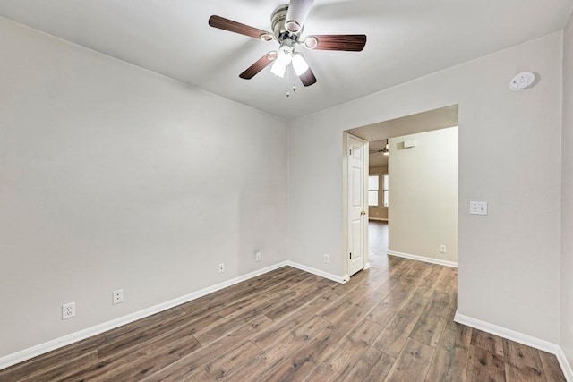 empty room with hardwood / wood-style flooring and ceiling fan