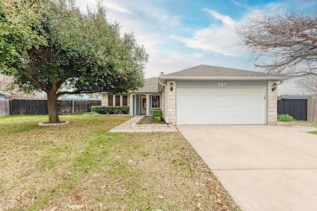 ranch-style home with a garage and a front lawn