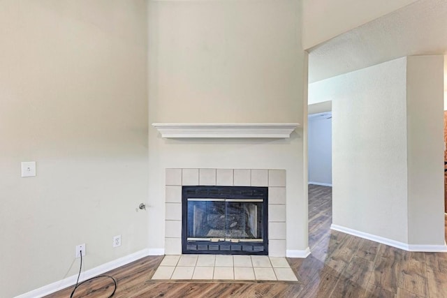 room details with a fireplace and wood-type flooring