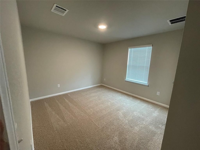 spare room featuring carpet flooring