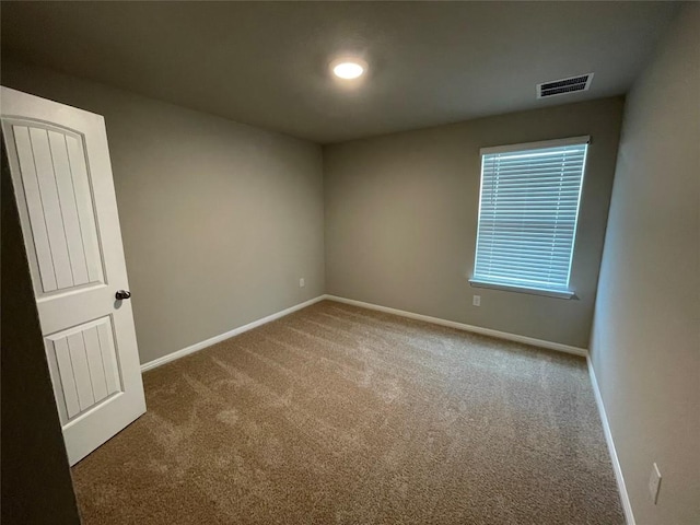 empty room featuring carpet floors