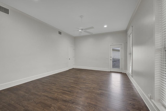 unfurnished room with ornamental molding, dark hardwood / wood-style floors, and ceiling fan