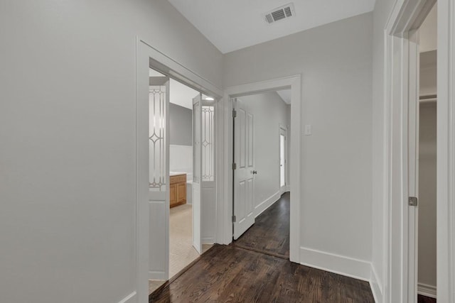 hallway featuring dark wood-type flooring