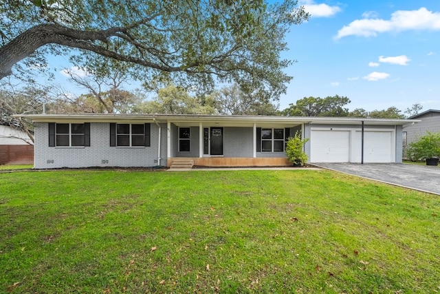 ranch-style house featuring a garage and a front yard