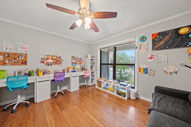 office space featuring ornamental molding, ceiling fan, and light wood-type flooring