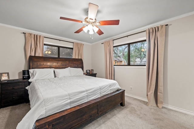 bedroom with crown molding, light colored carpet, and ceiling fan