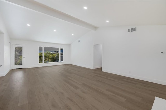 unfurnished living room with dark wood-type flooring and lofted ceiling with beams