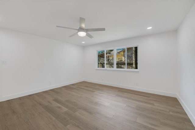 unfurnished room featuring light hardwood / wood-style flooring and ceiling fan