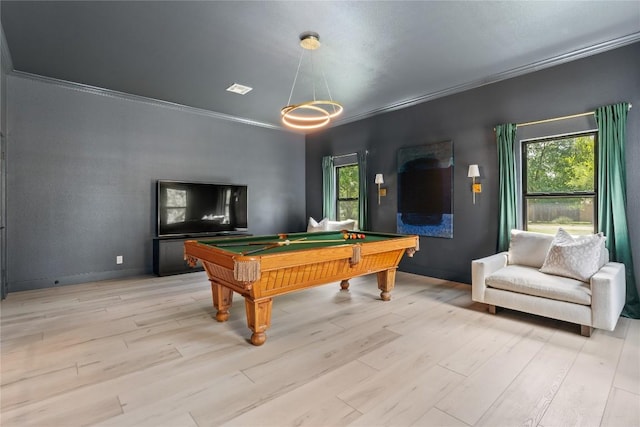 rec room featuring ornamental molding, light wood-style floors, plenty of natural light, and billiards