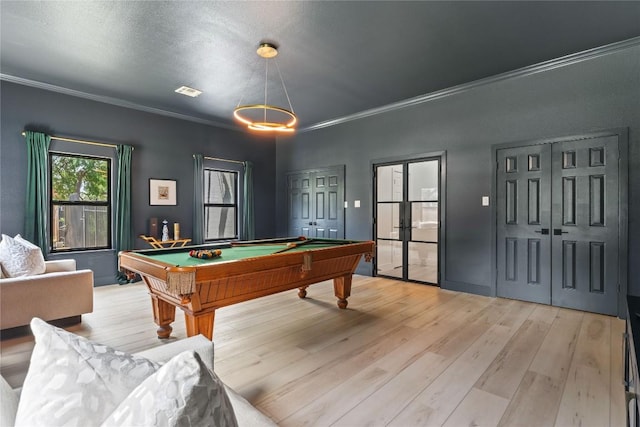 recreation room featuring light wood-style floors, ornamental molding, and pool table