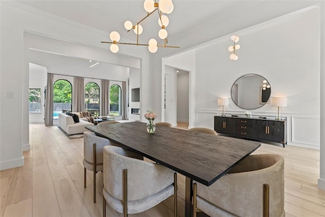 608 Whispering Oaks Dr, Salado, TX 76571 - dining area with light wood-type flooring, a chandelier, and baseboards