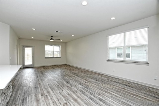 empty room featuring wood-type flooring and ceiling fan