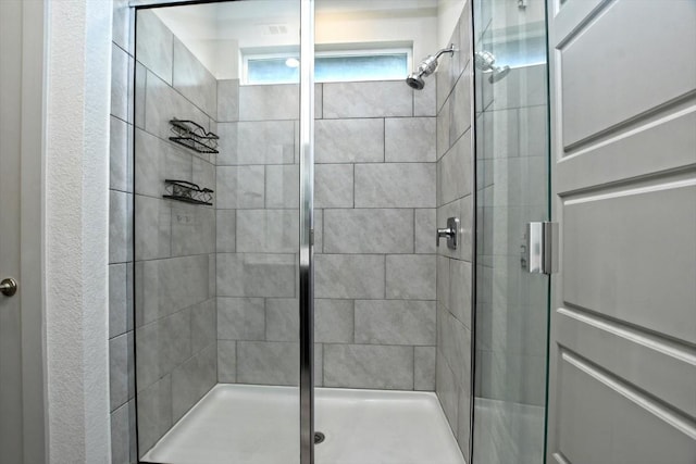 bathroom featuring an enclosed shower