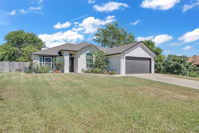 view of front facade featuring a garage and a front lawn