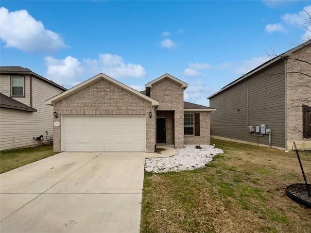 view of front of property featuring a garage and a front yard