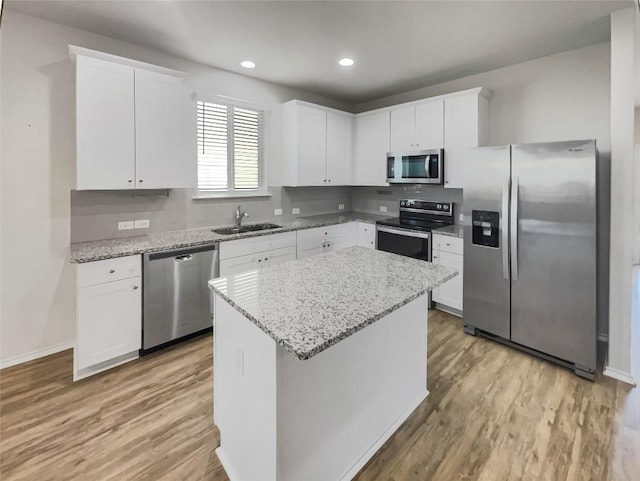 kitchen featuring sink, white cabinets, and appliances with stainless steel finishes