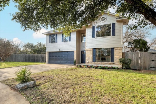 raised ranch with a garage and a front yard