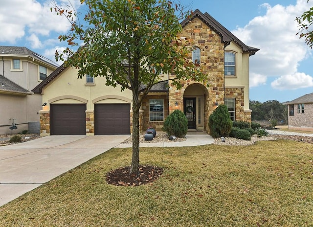 view of front property with a garage and a front yard