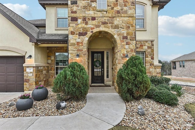 doorway to property featuring a garage