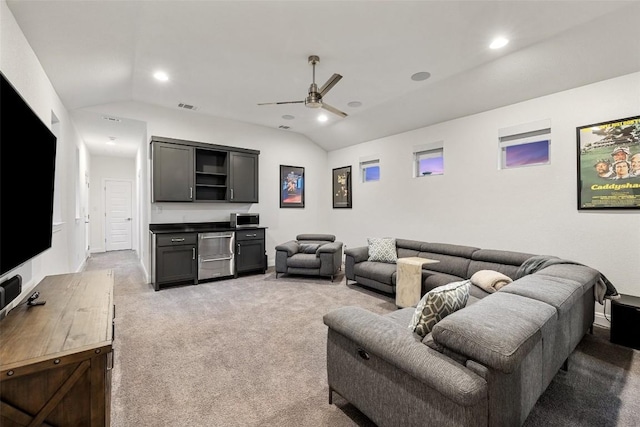 carpeted living room with vaulted ceiling and ceiling fan