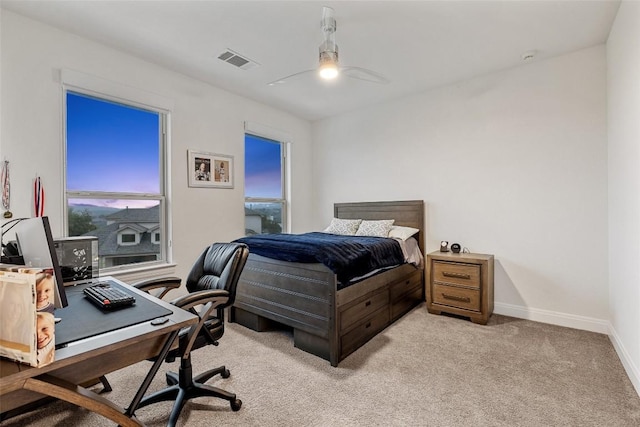 bedroom with light carpet and ceiling fan