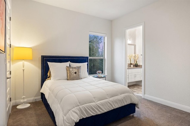 carpeted bedroom featuring ensuite bath