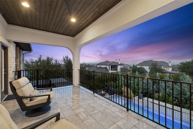 view of balcony at dusk