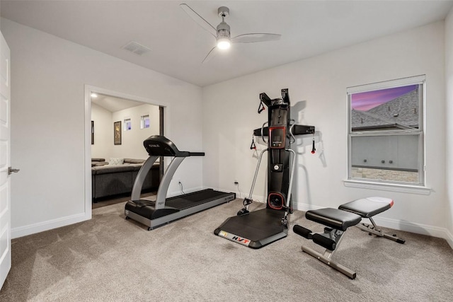 workout room with ceiling fan and carpet