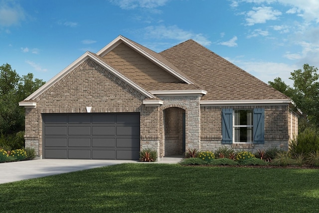 view of front of property featuring a garage and a front lawn