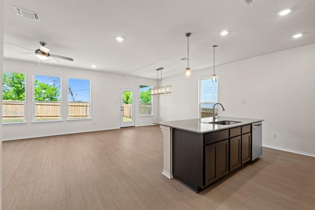 19216 Lady Bird Johnson St, Manor, TX 78653 - kitchen with light wood-style flooring, open floor plan, dishwasher, recessed lighting, and a center island with sink