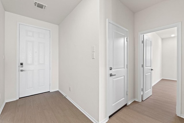 19216 Lady Bird Johnson St, Manor, TX 78653 - hall with light wood-style flooring and baseboards