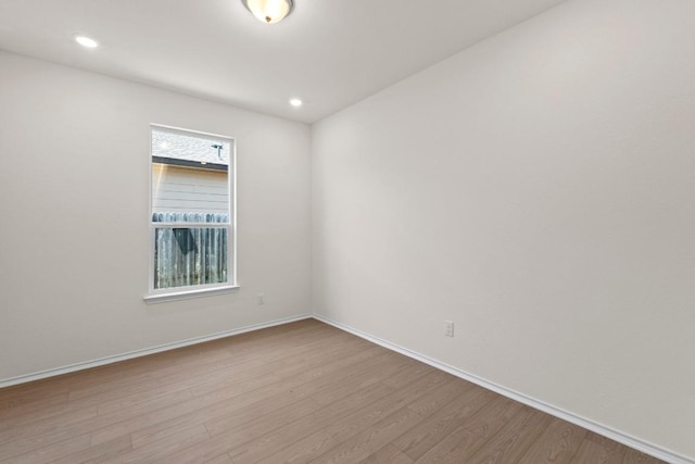 19216 Lady Bird Johnson St, Manor, TX 78653 - spare room featuring wood finished floors and recessed lighting