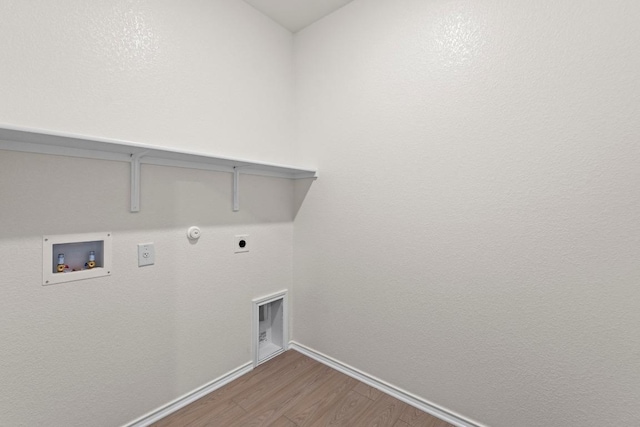 19216 Lady Bird Johnson St, Manor, TX 78653 - laundry room featuring hookup for a gas dryer, wood finished floors, hookup for an electric dryer, and hookup for a washing machine
