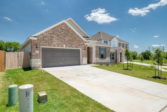 19216 Lady Bird Johnson St, Manor, TX 78653 - traditional-style home with a garage, brick siding, and concrete driveway