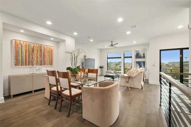 dining space featuring ceiling fan and wood-type flooring