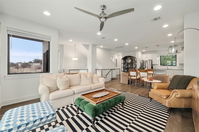 2050 Lohmans Spur Rd Unit 101, Lakeway, TX 78734 - living room with dark wood-style flooring, a ceiling fan, visible vents, and recessed lighting